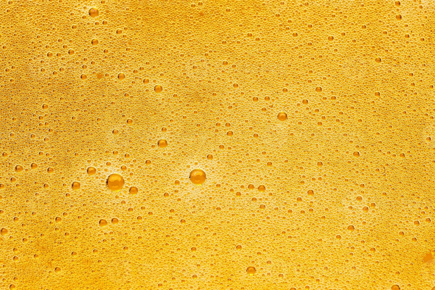 Texture of gas bubbles in light beer. photo