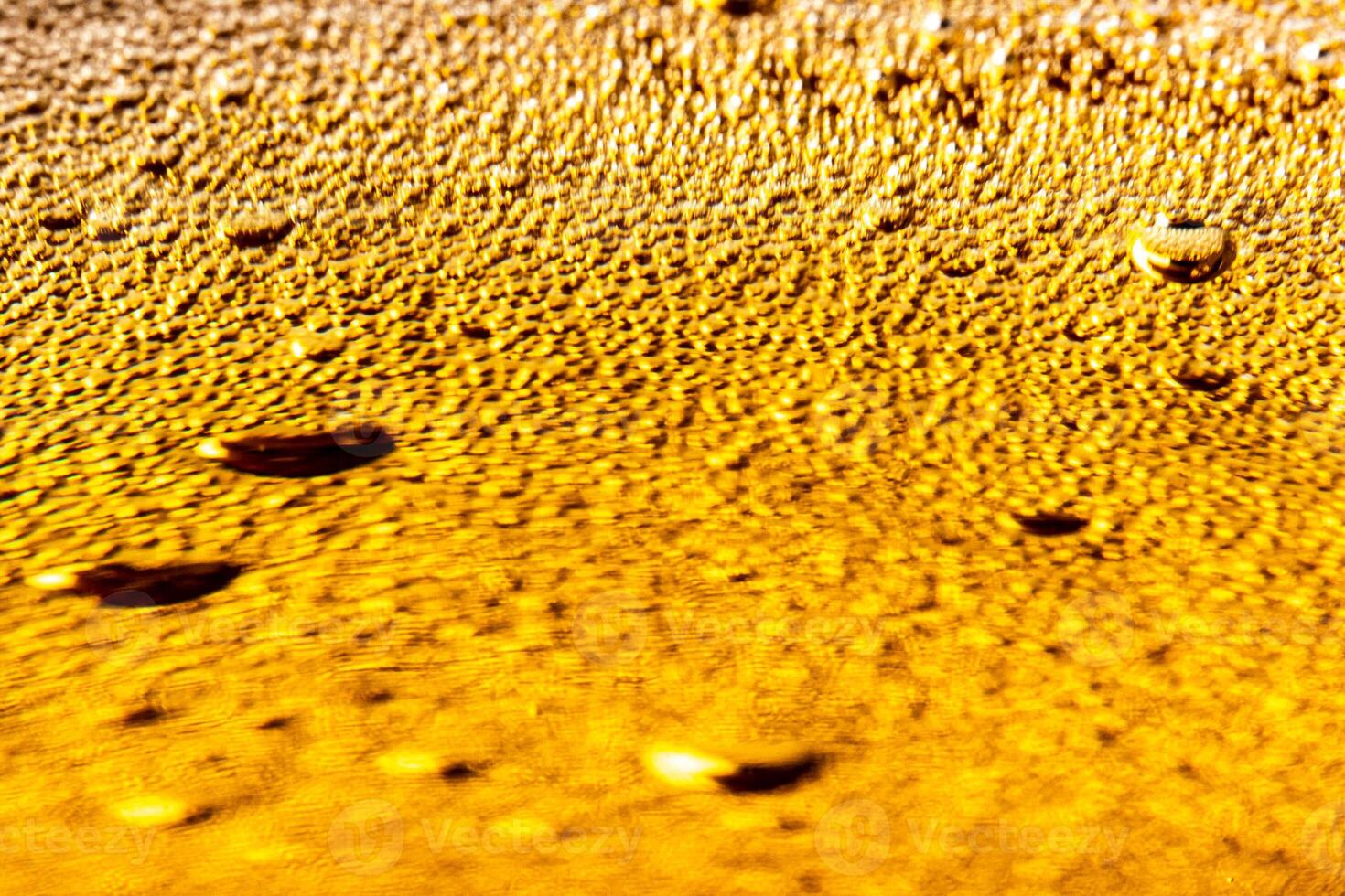 Texture of gas bubbles in light beer. photo