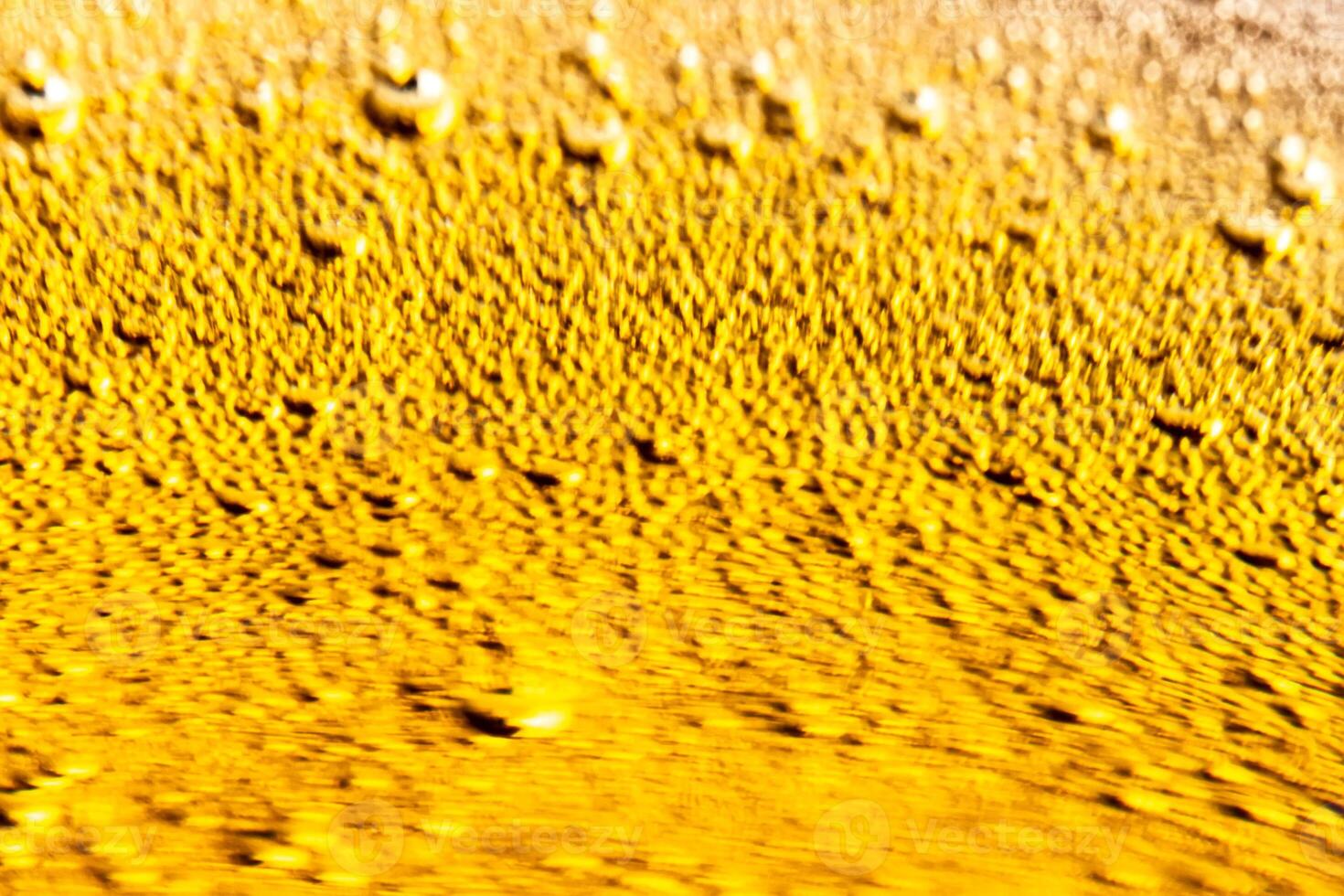 Texture of gas bubbles in light beer. photo