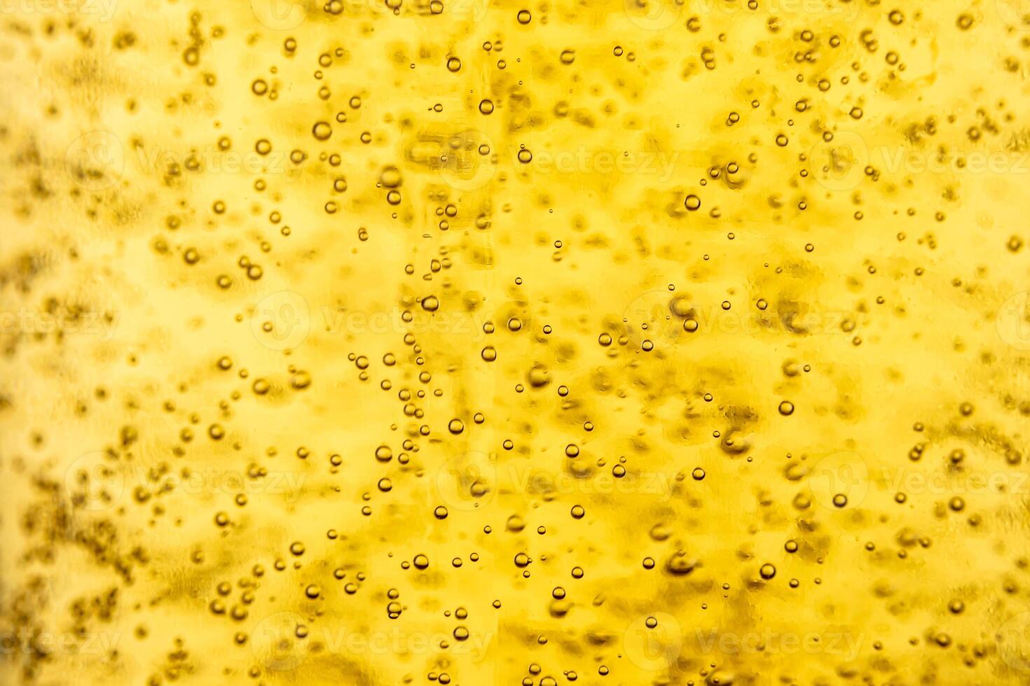 Texture of gas bubbles in light beer. photo