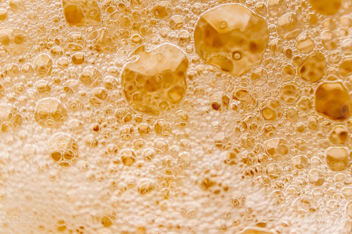 Texture of gas bubbles in light beer. photo