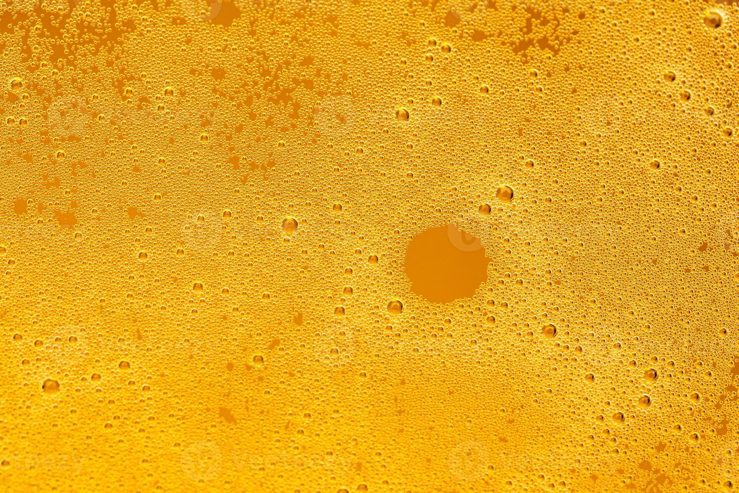 Texture of gas bubbles in light beer. photo