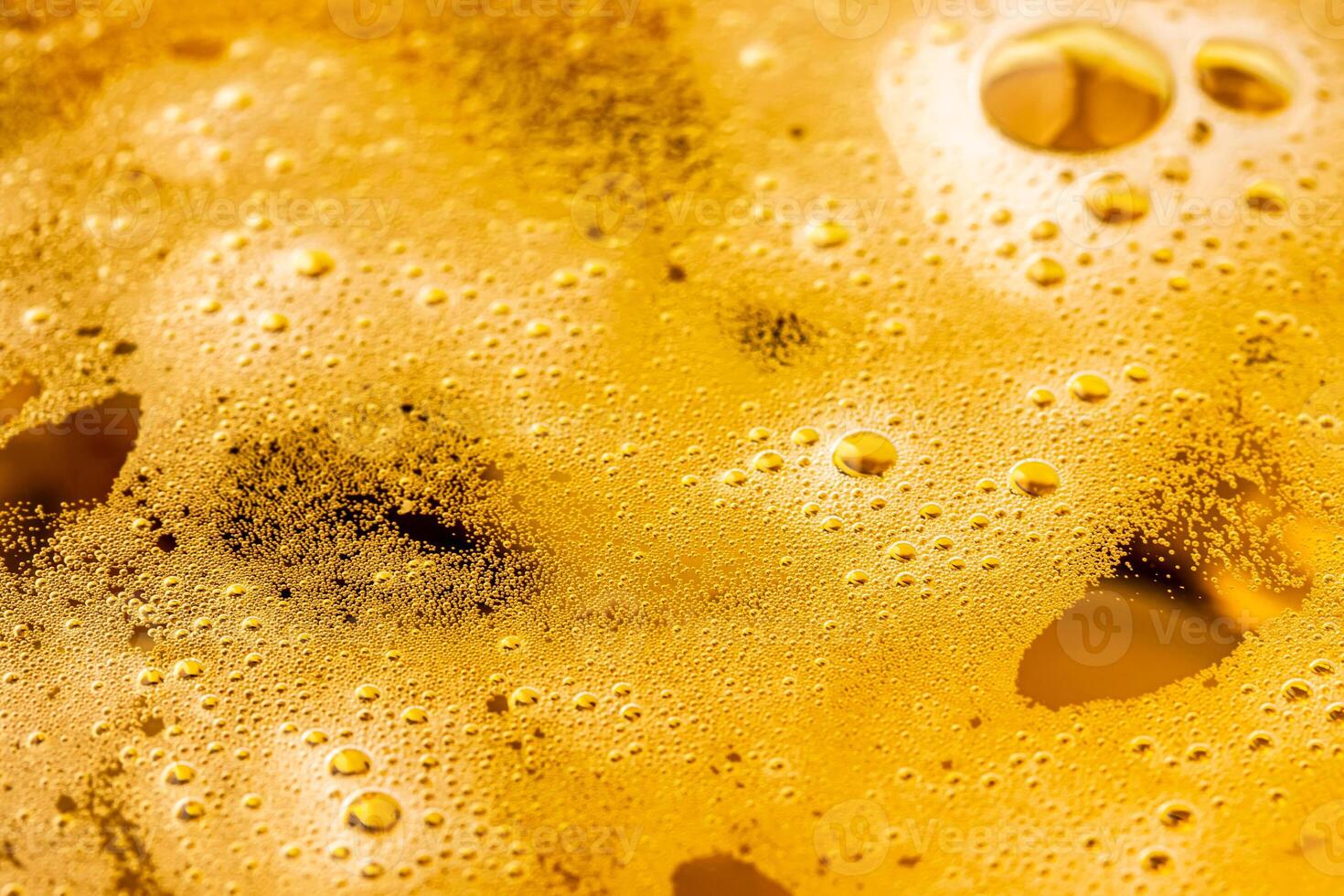 Texture of gas bubbles in light beer. photo