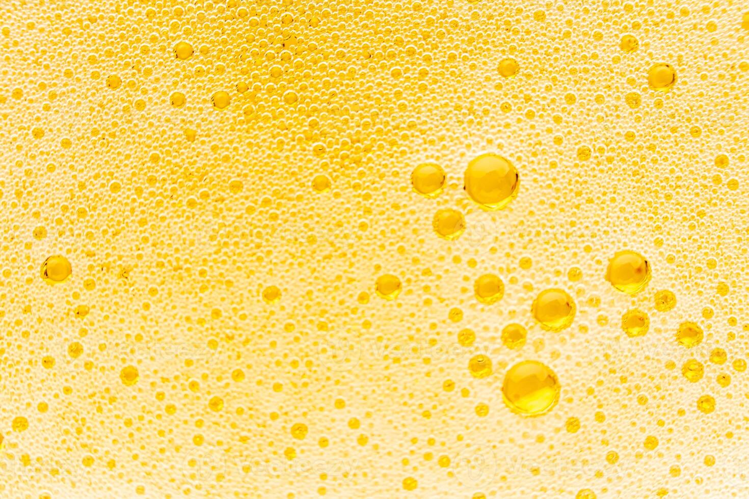 Texture of gas bubbles in light beer. photo