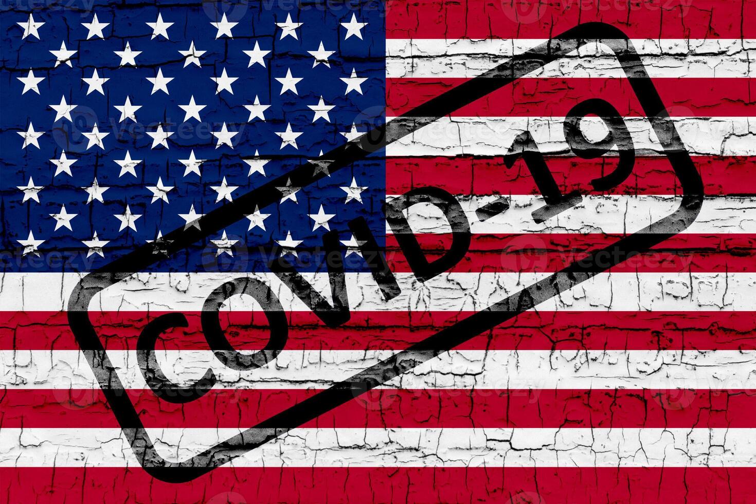 USA flag on cracked concrete wall. photo