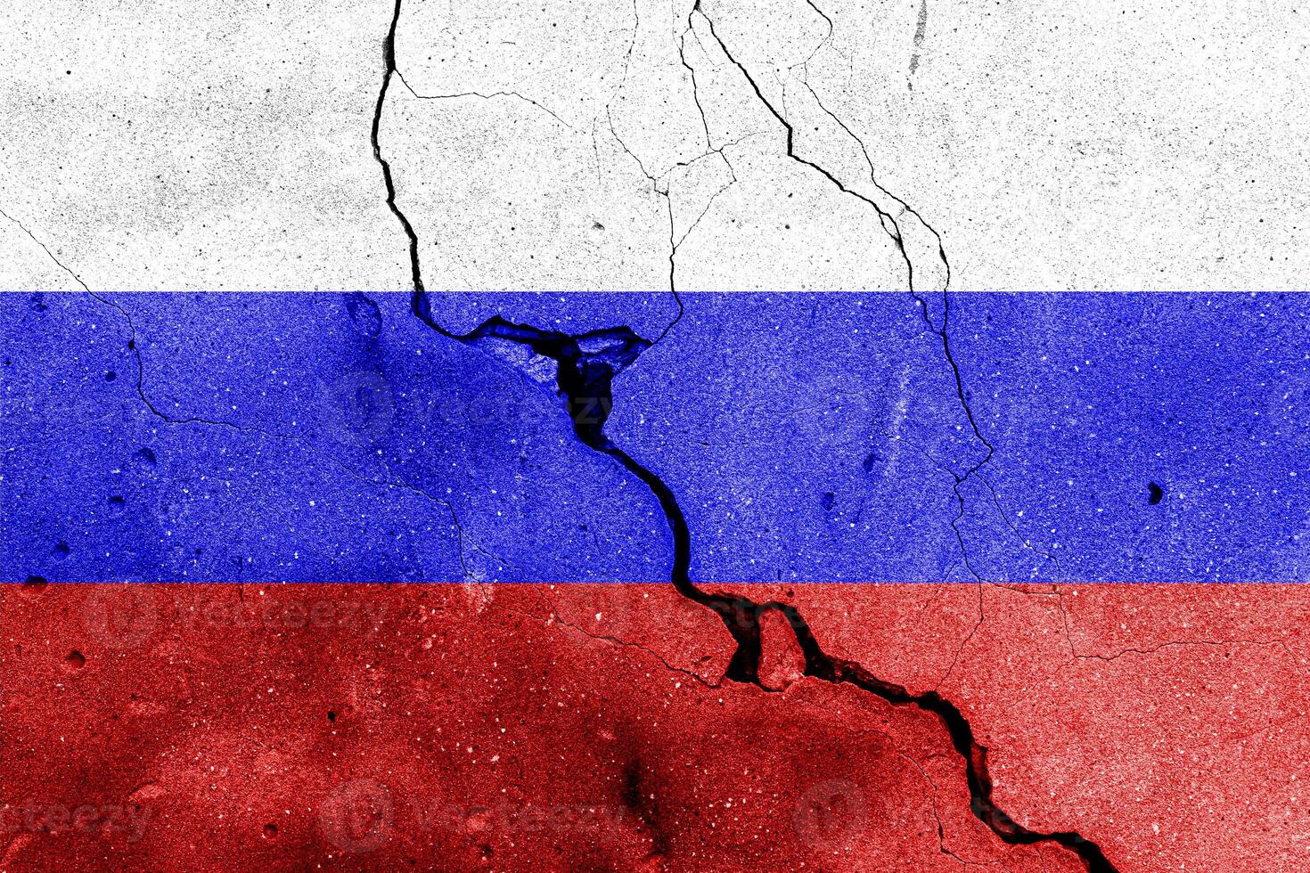 Russian Federation flag on cracked concrete wall. The concept of crisis, default, economic collapse, pandemic, conflict, terrorism or other problems in the country. Abstract disaster symbol. photo