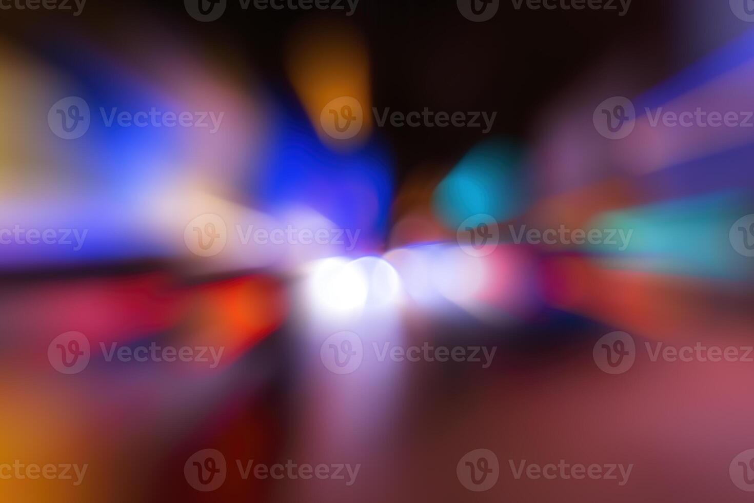 Blurred lights of headlights of cars and lanterns in the night city. Abstract bokeh. photo