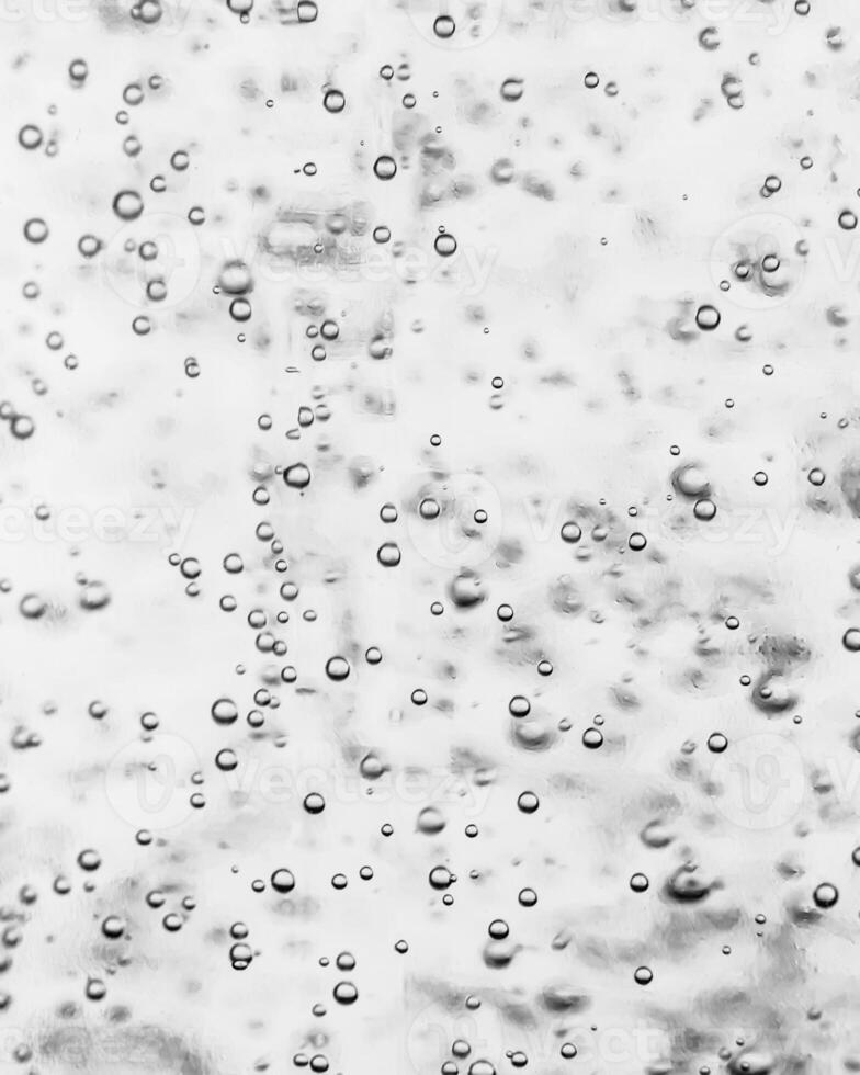 Monochrome background with air bubbles in the liquid. Carbonated drinks. Abstract backdrop. photo