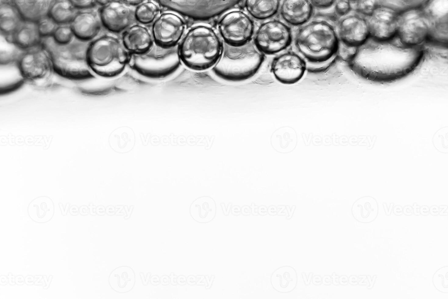 Monochrome background with air bubbles in the liquid. Gel detergents. Abstract backdrop. photo
