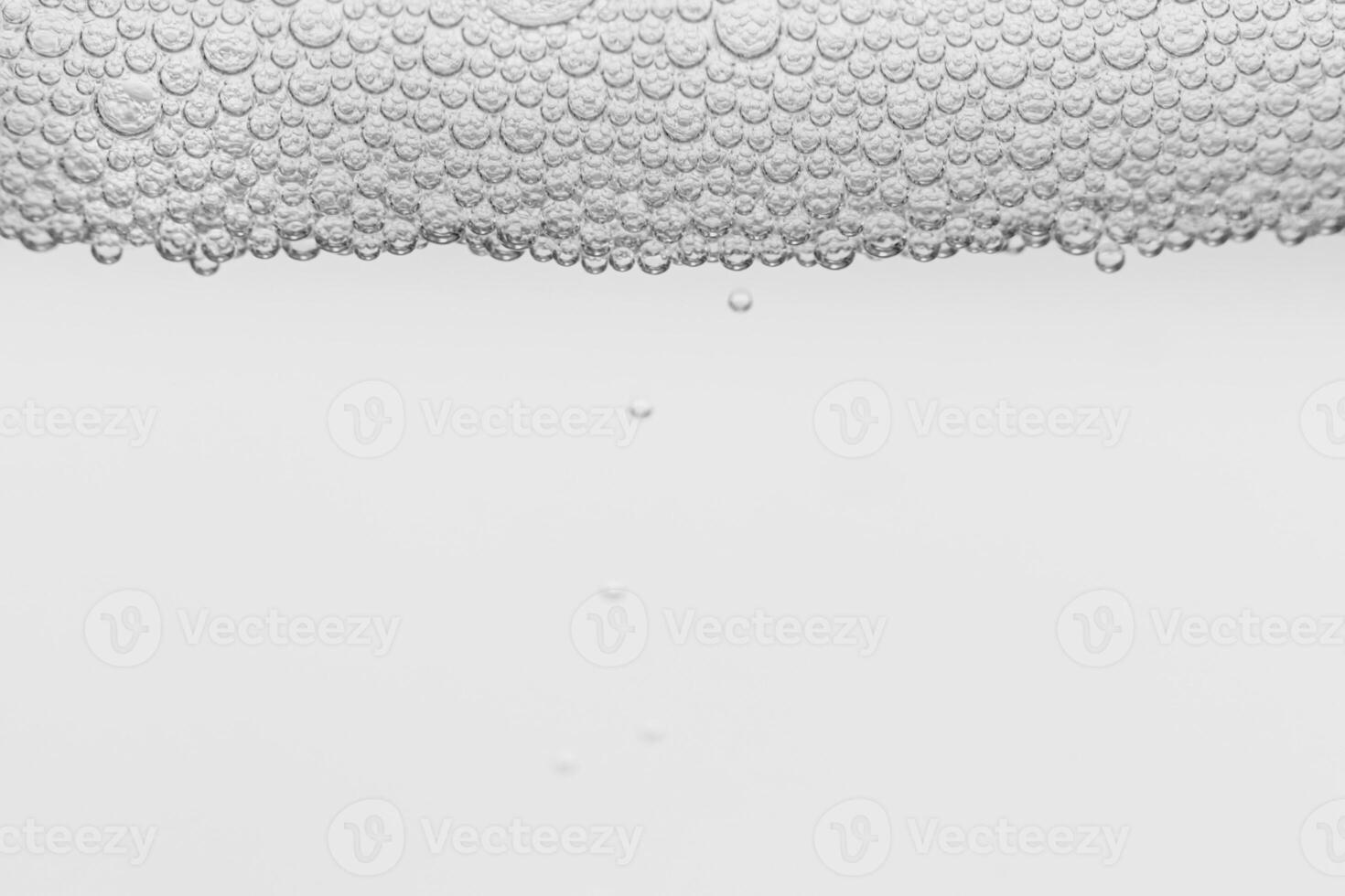 Monochrome background with air bubbles in the liquid. Gel detergents. Abstract backdrop. photo