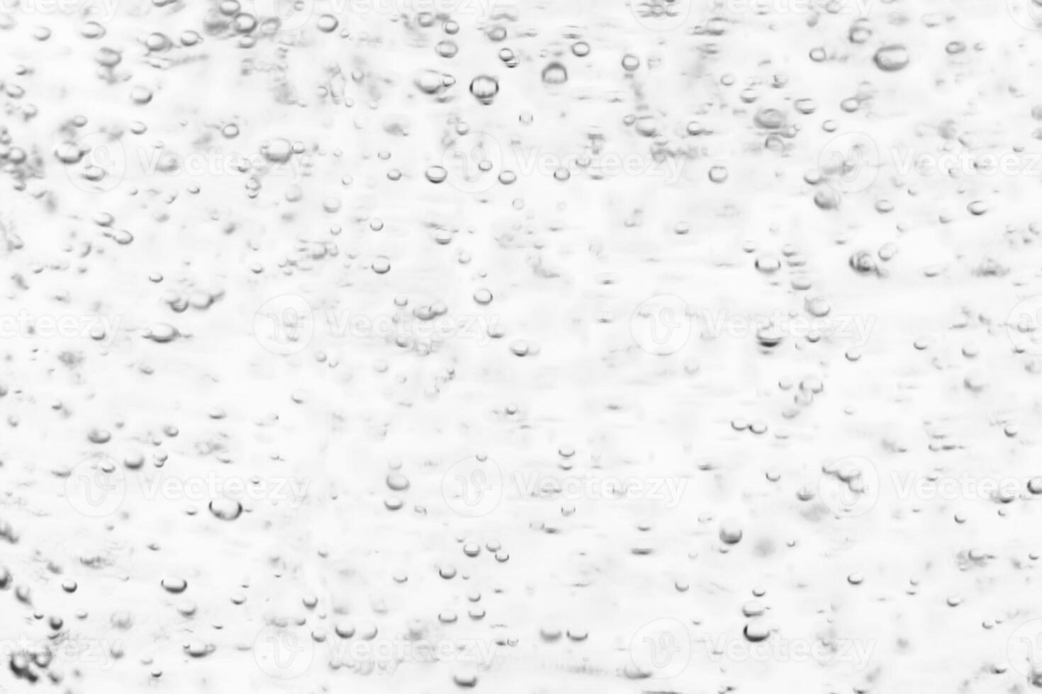 Monochrome background with air bubbles in the liquid. Carbonated drinks. Abstract backdrop. photo