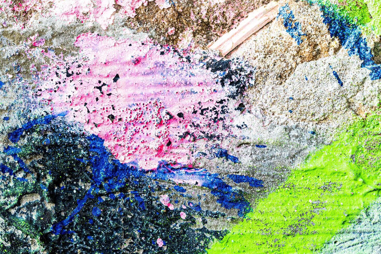 Fragment of colored graffiti painted on a wall. Bright abstract background for design. Spray pictures. photo