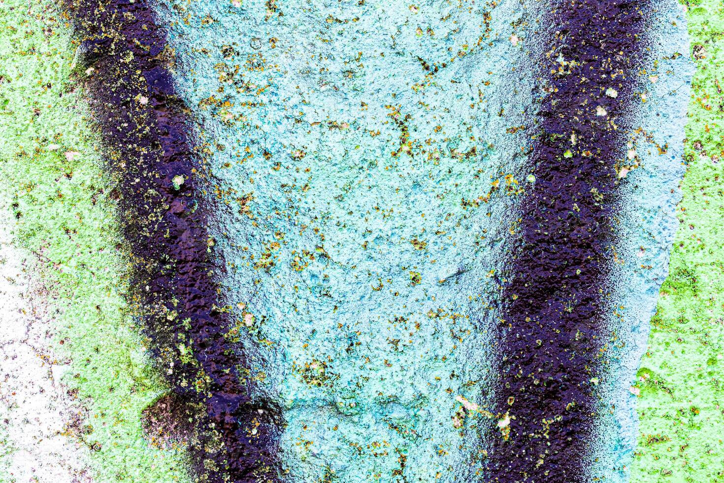 Fragment of colored graffiti painted on a wall. Bright abstract background for design. Spray pictures. photo