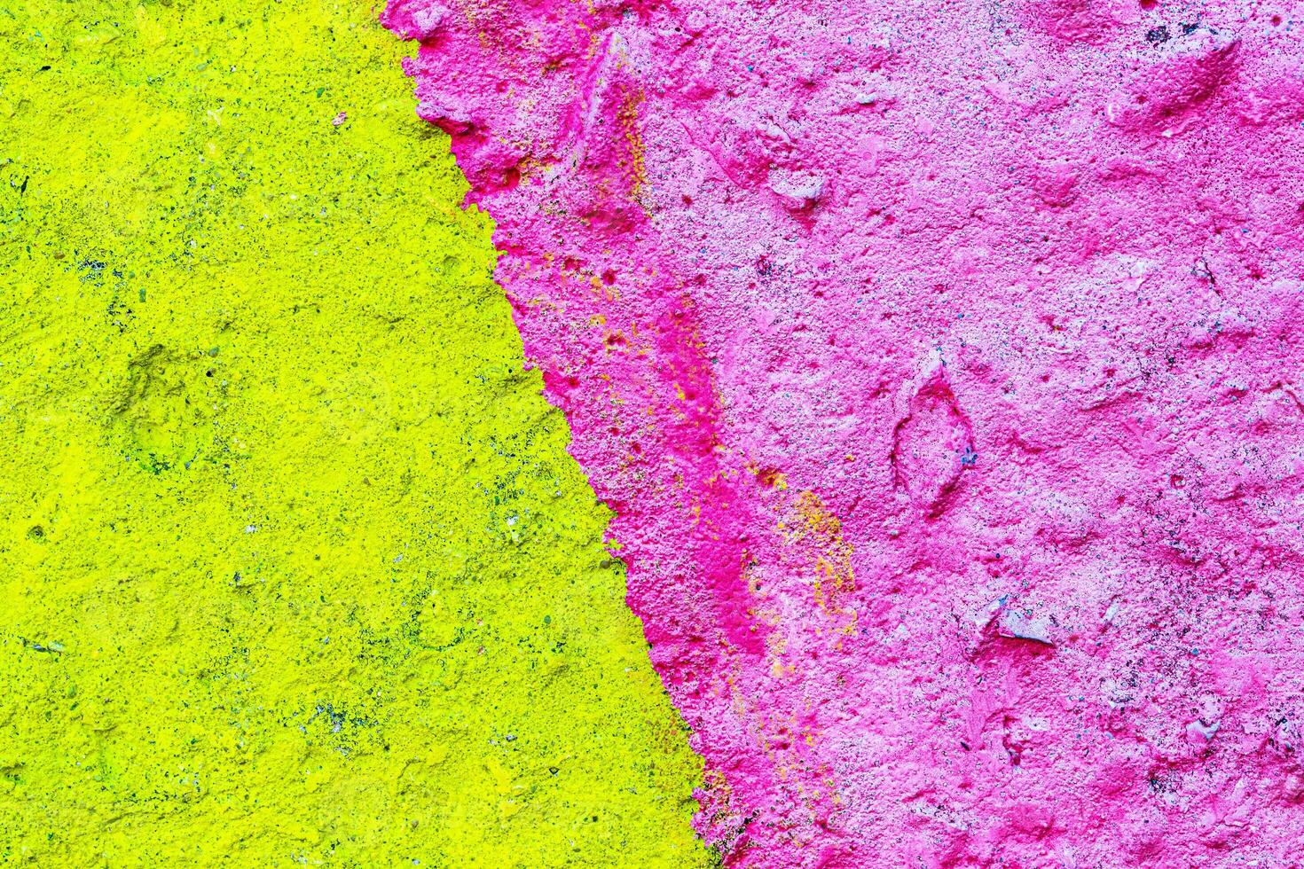 Fragment of colored graffiti painted on a wall. Bright abstract background for design. Spray pictures. photo