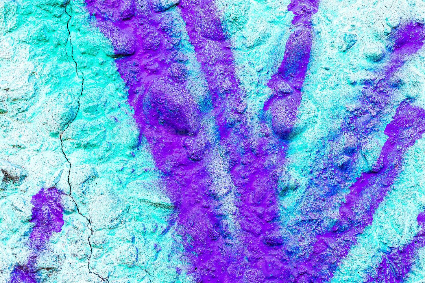 Fragment of colored graffiti painted on a wall. Bright abstract background for design. Spray pictures. photo