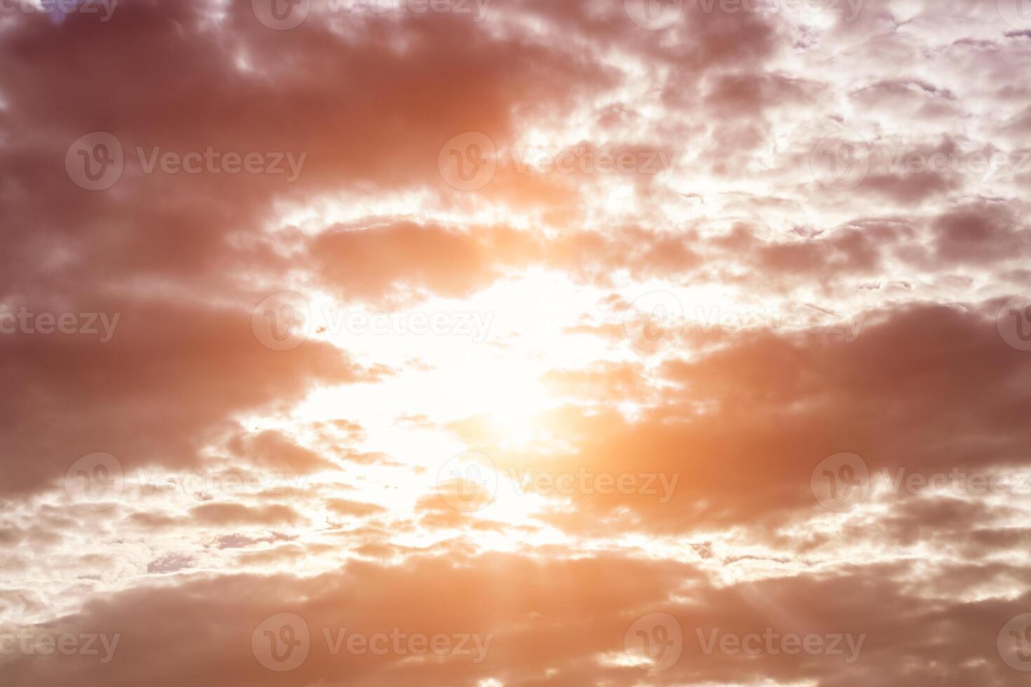 Sun rays breaking through cumulus clouds. The concept of divine light, a glimmer of hope or overcoming difficulties. Spiritual religious background. photo