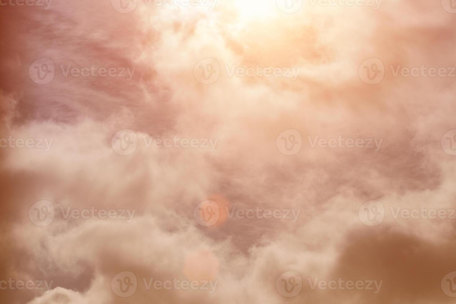 Sun rays breaking through cumulus clouds. The concept of divine light, a glimmer of hope or overcoming difficulties. Spiritual religious background. photo