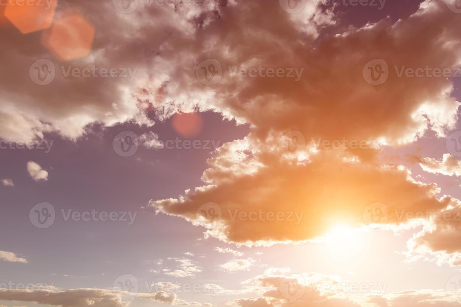 Sun rays breaking through cumulus clouds. The concept of divine light, a glimmer of hope or overcoming difficulties. Spiritual religious background. photo
