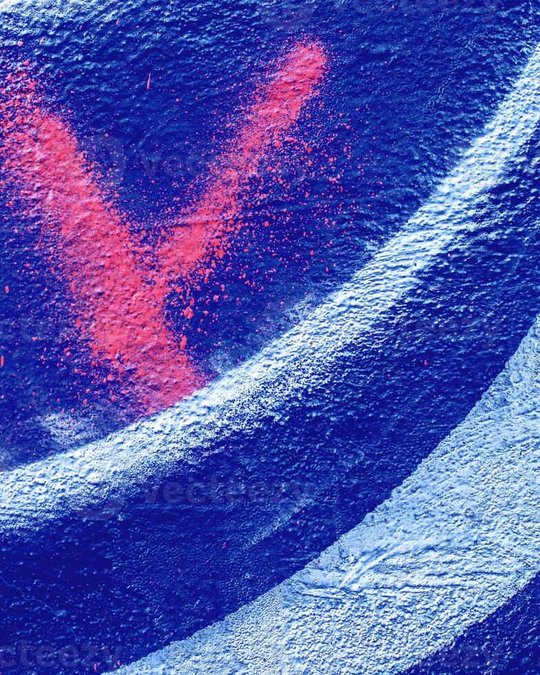 Fragment of colored graffiti painted on a wall. photo