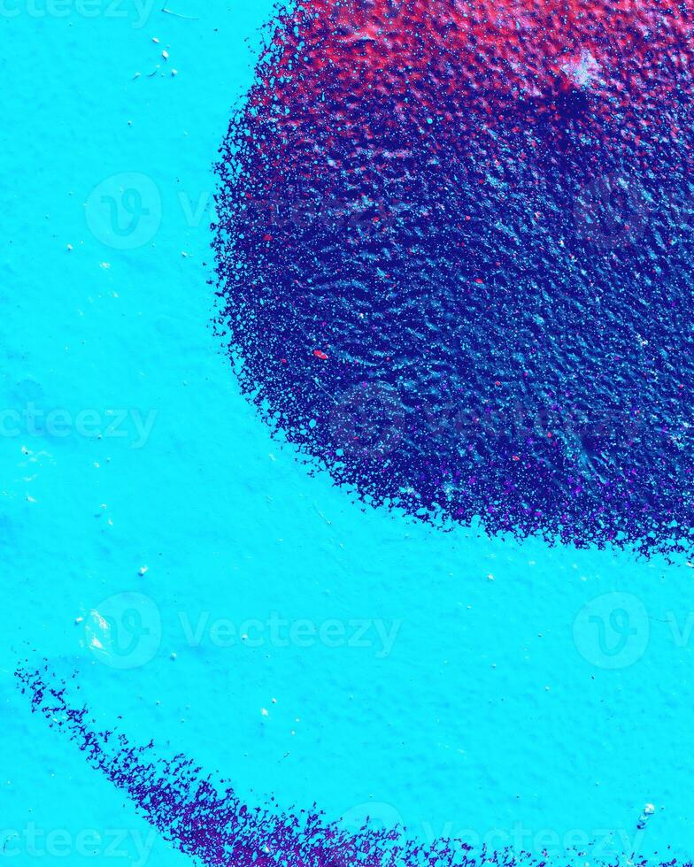 Fragment of colored graffiti painted on a wall. photo