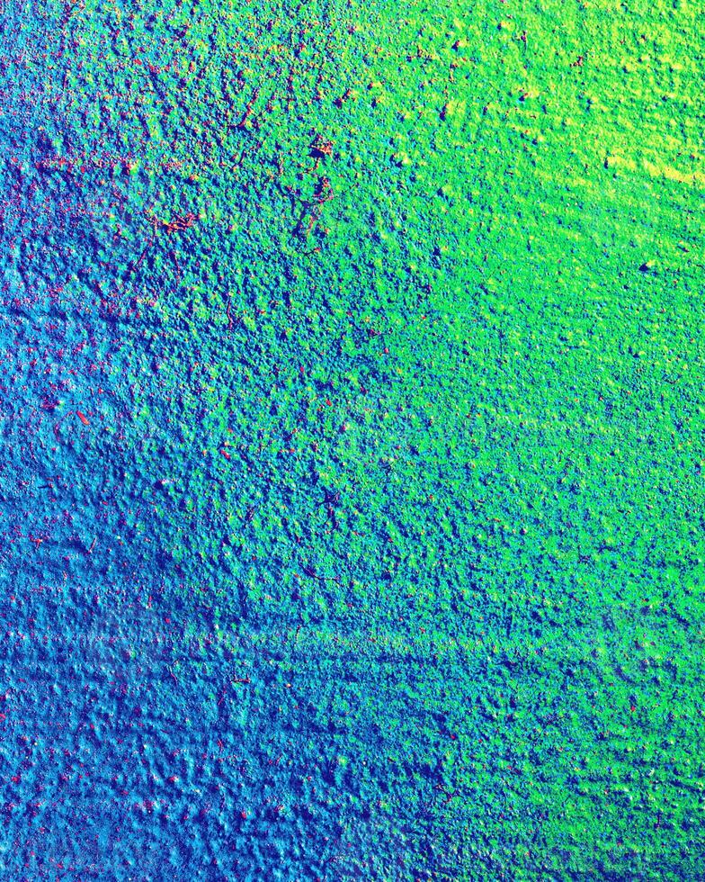 Fragment of colored graffiti painted on a wall. photo