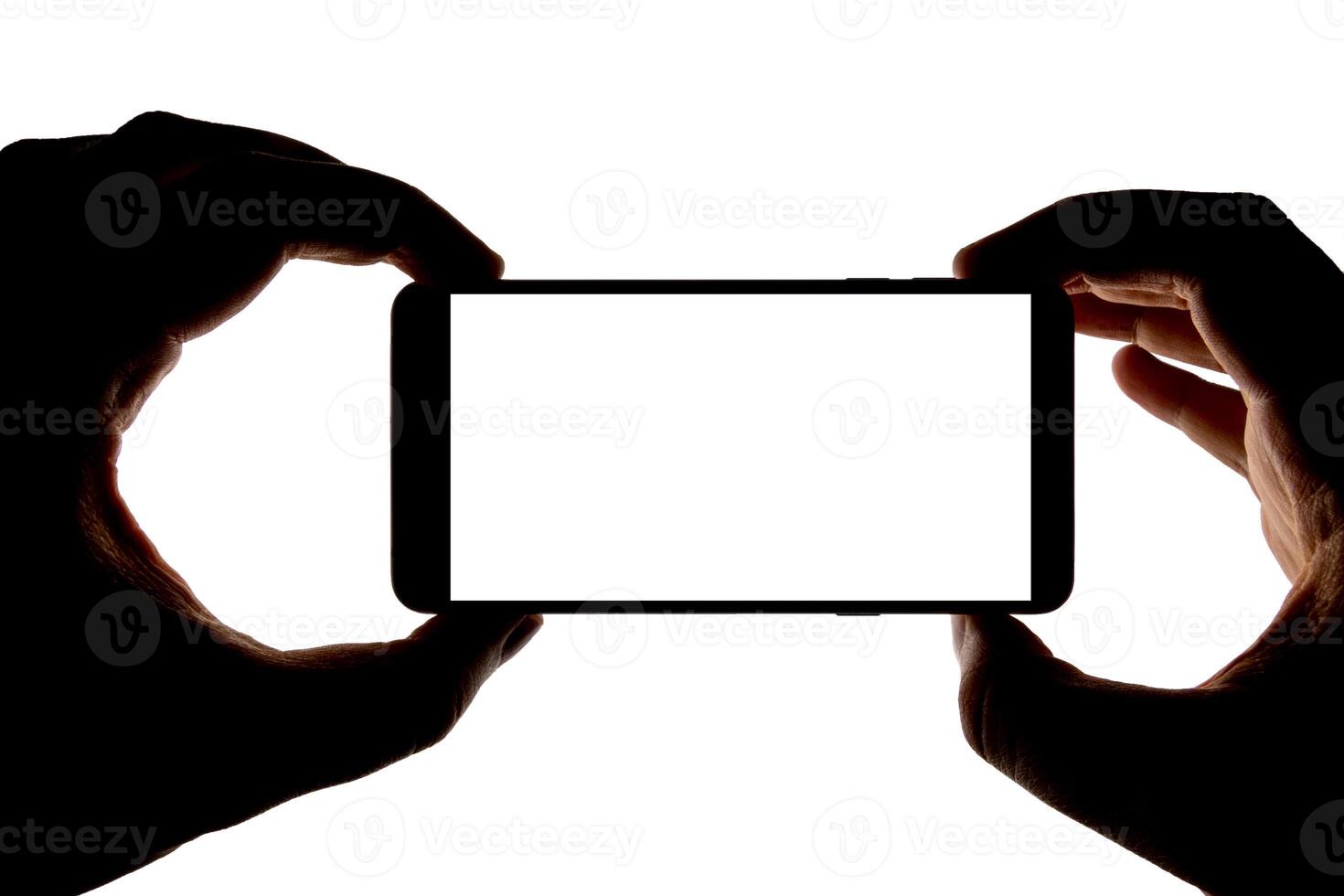Silhouette of hands with smartphone taking picture isolated on white background. Screen with copy space. Blank for design. photo