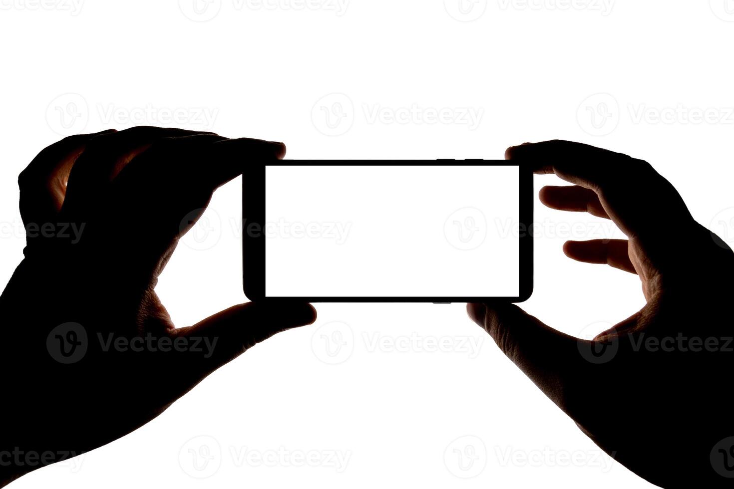 Silhouette of hands with smartphone taking picture isolated on white background. Screen with copy space. Blank for design. photo