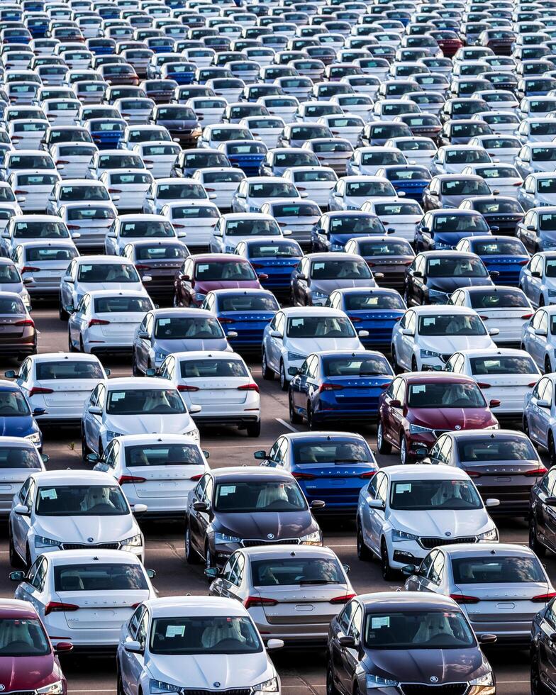 Volkswagen Group Rus, Russia, Kaluga - MAY 25, 2020 Rows of a new cars parked in a distribution center. Parking in the open air. photo