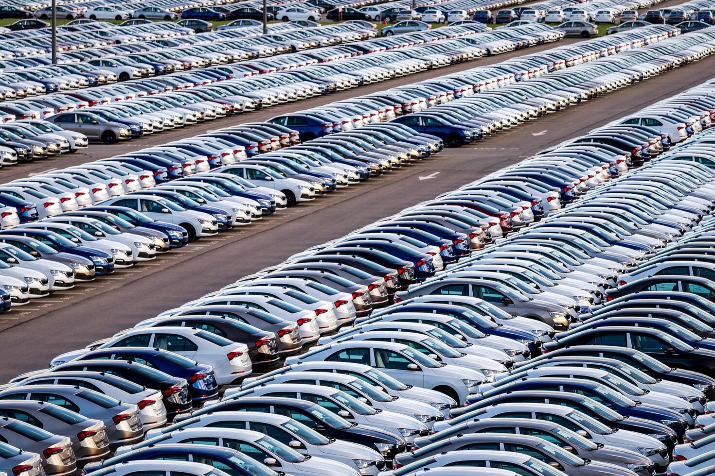 Volkswagen Group Rus, Russia, Kaluga - MAY 25, 2020 Rows of a new cars parked in a distribution center. Parking in the open air. photo