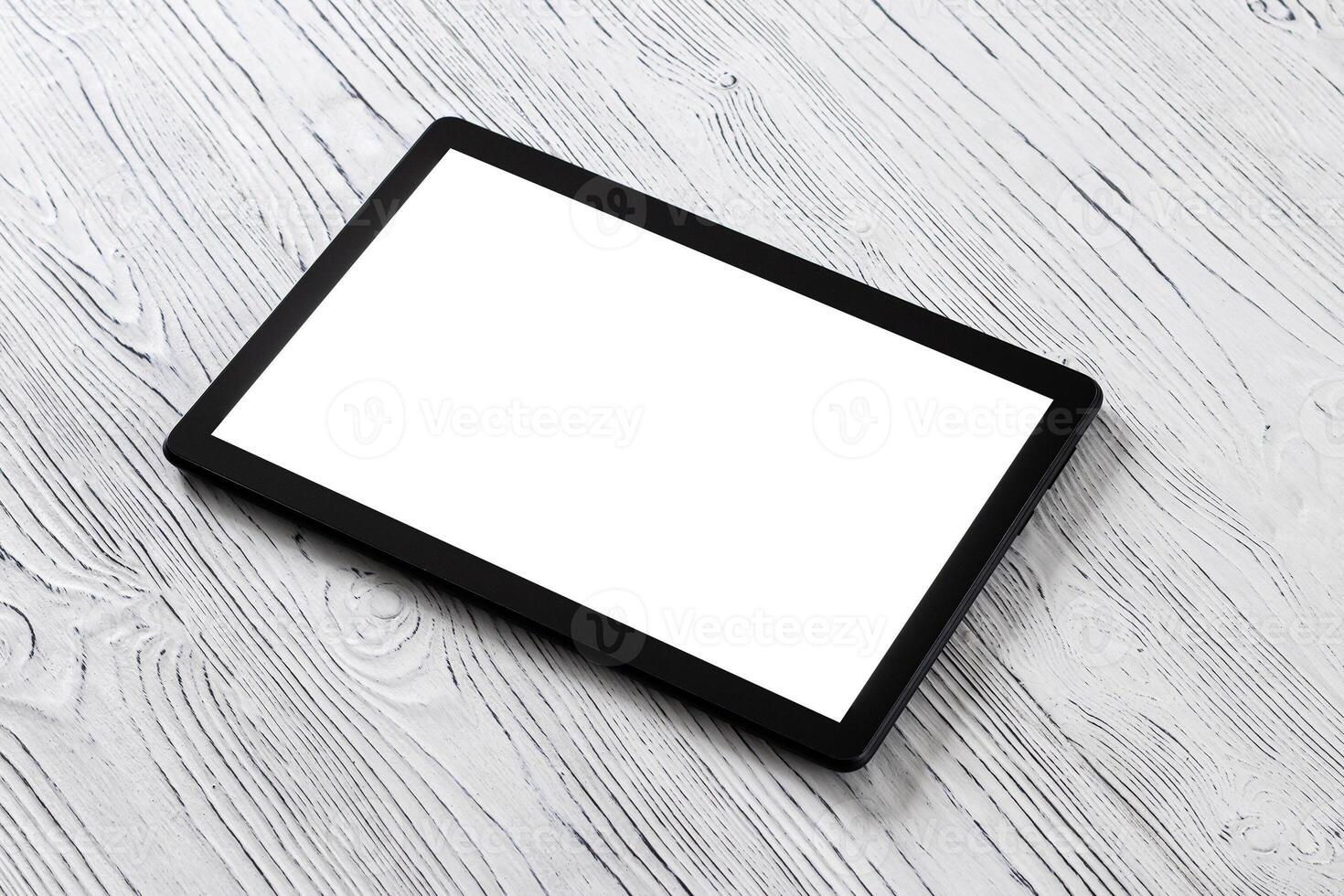 KALUGA, RUSSIAN FEDERATION - MAY 5 Tablet computer on a black wooden table. photo