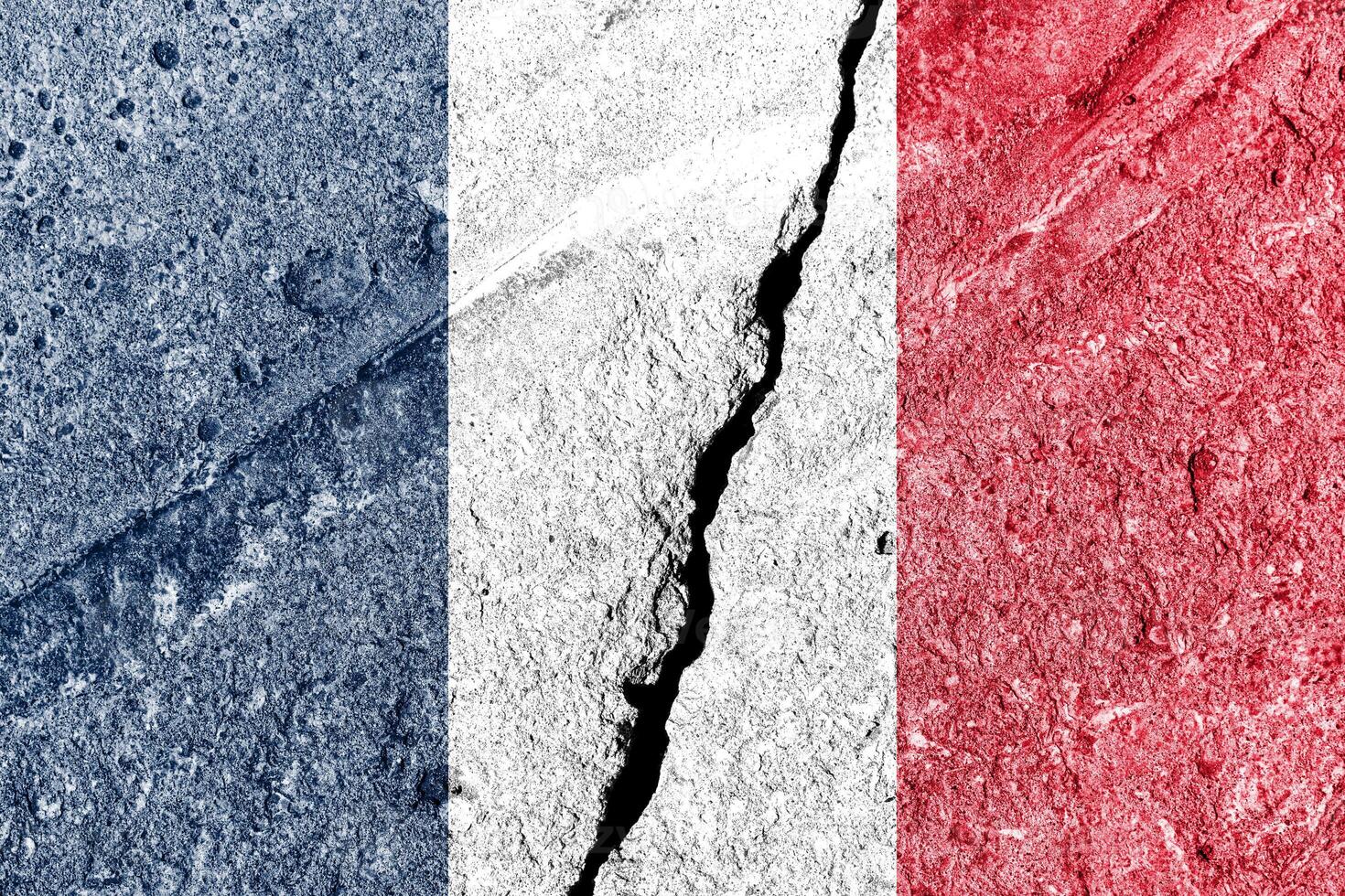 France flag on cracked concrete wall. The concept of crisis, conflict, terrorism or other problems in the country. photo