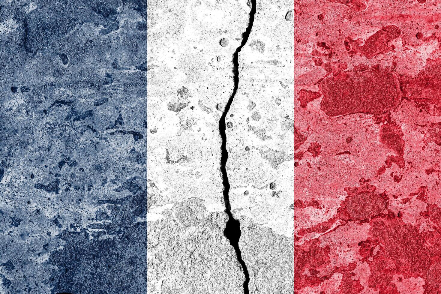 France flag on cracked concrete wall. The concept of crisis, conflict, terrorism or other problems in the country. photo