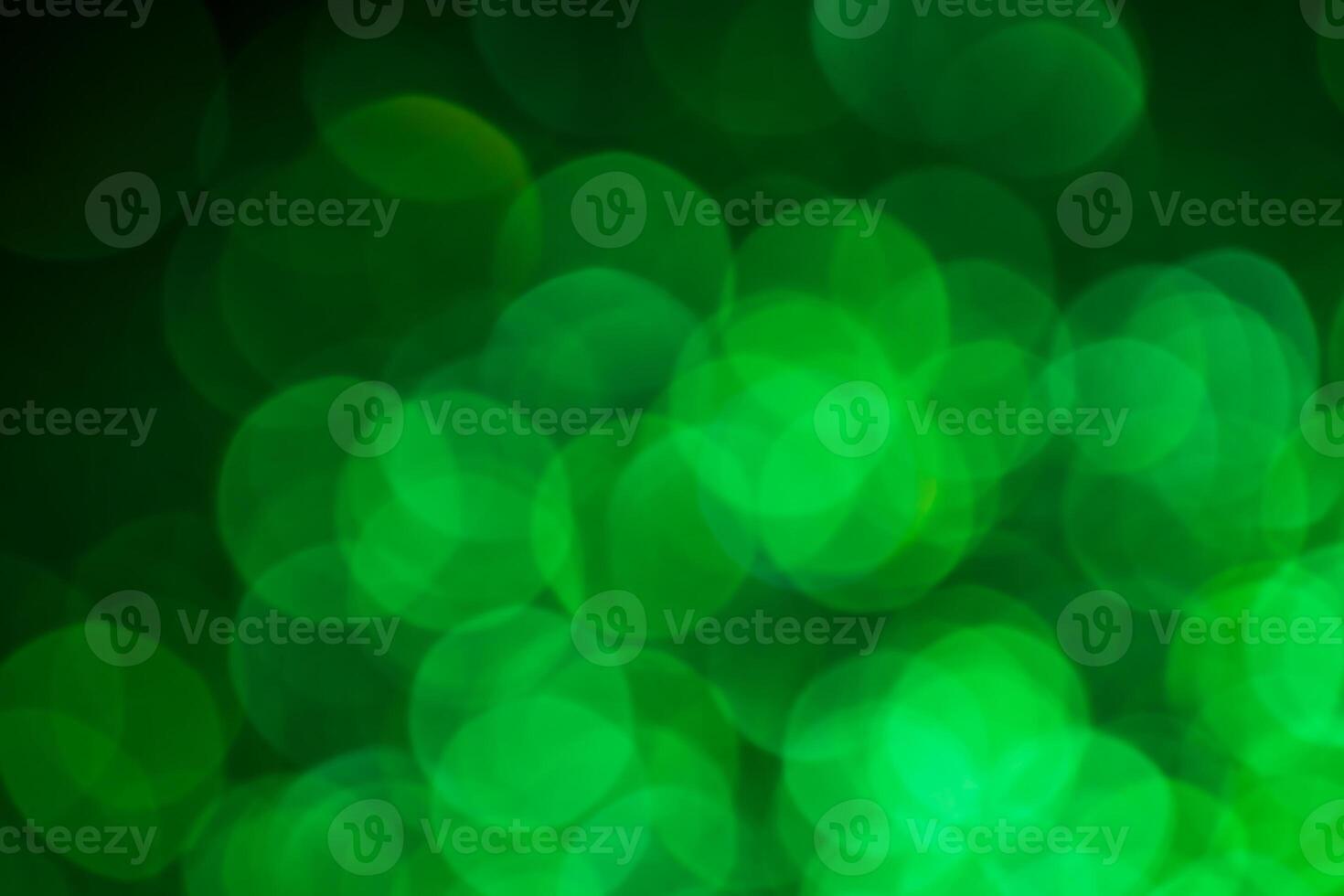 Green lights abstract bokeh backdrop. Chrismas lights bokeh. photo