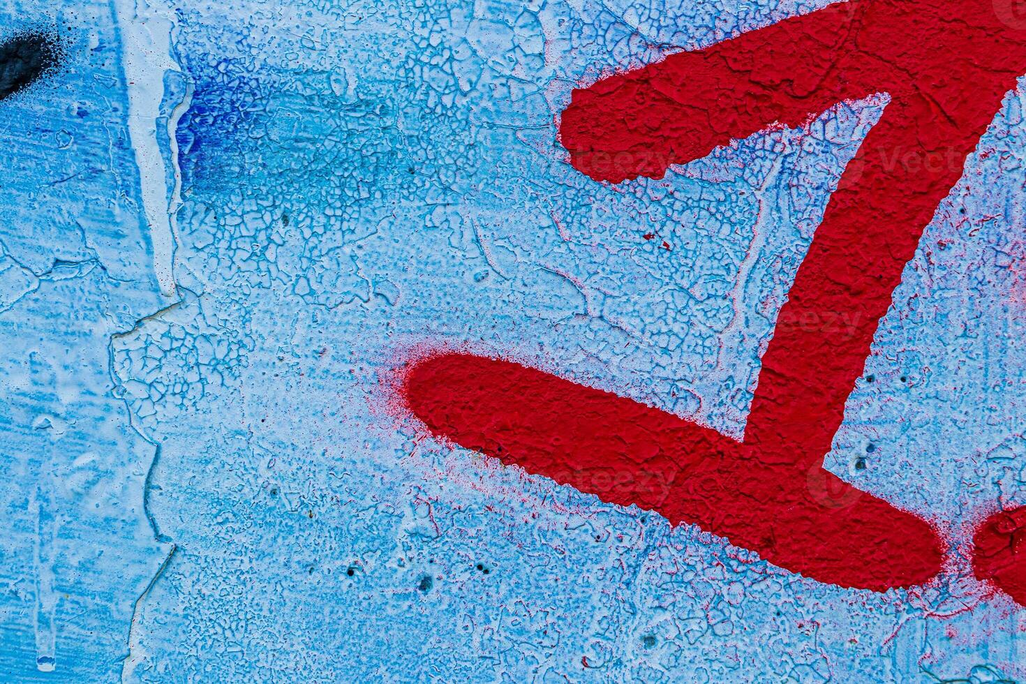 A fragment of colorful graffiti painted on a concrete wall. Abstract urban backdrop for design. photo