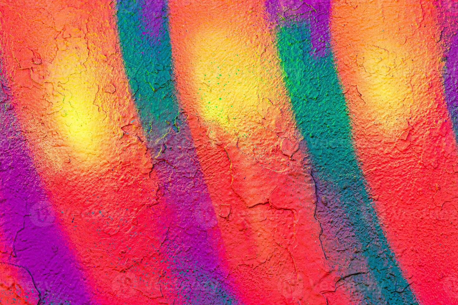 A fragment of colorful graffiti painted on a concrete wall. Abstract urban backdrop for design. photo