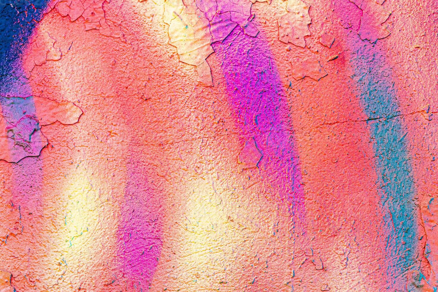 A fragment of colorful graffiti painted on a concrete wall. Abstract urban backdrop for design. photo