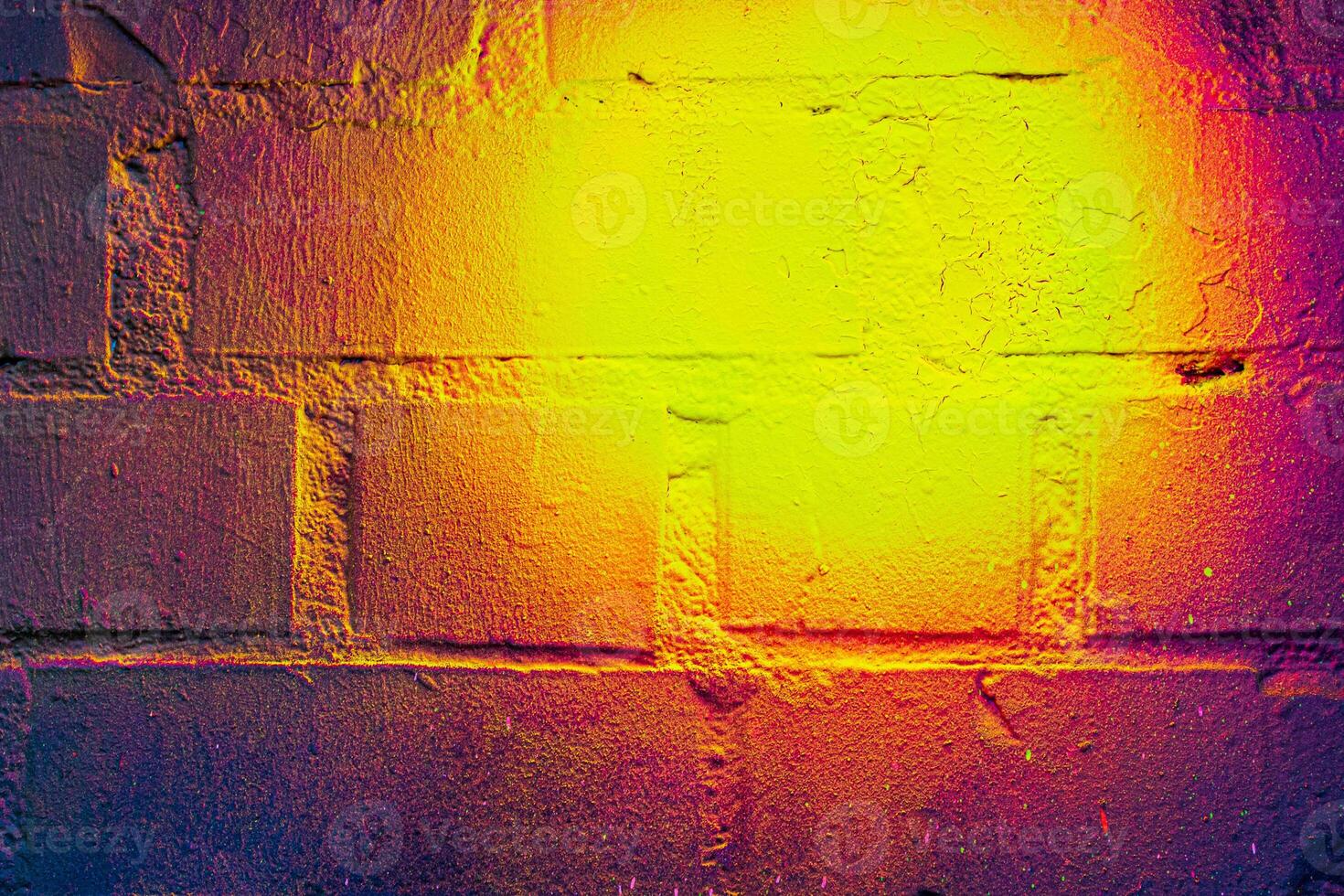 A fragment of colorful graffiti painted on a brick wall. Abstract backdrop for design. photo
