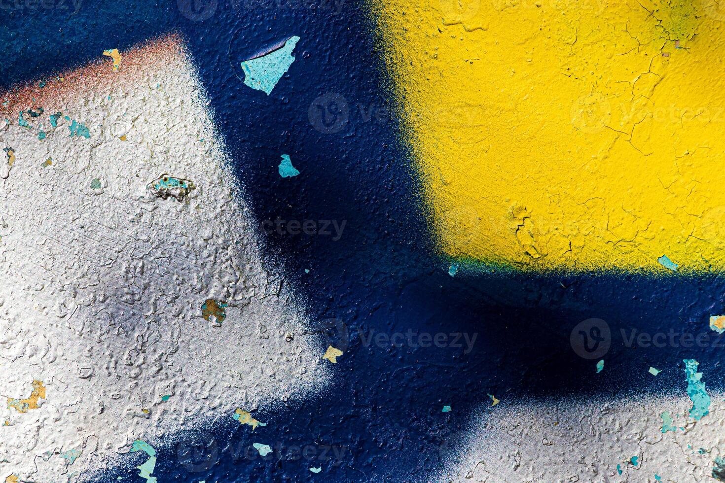 A fragment of colorful graffiti painted on a concrete wall. Abstract urban backdrop for design. photo