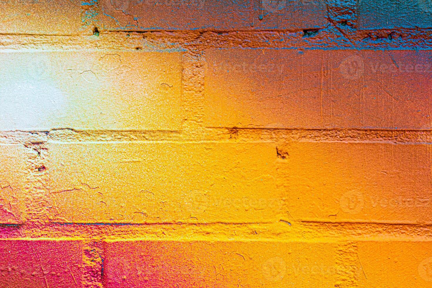A fragment of colorful graffiti painted on a brick wall. Abstract backdrop for design. photo