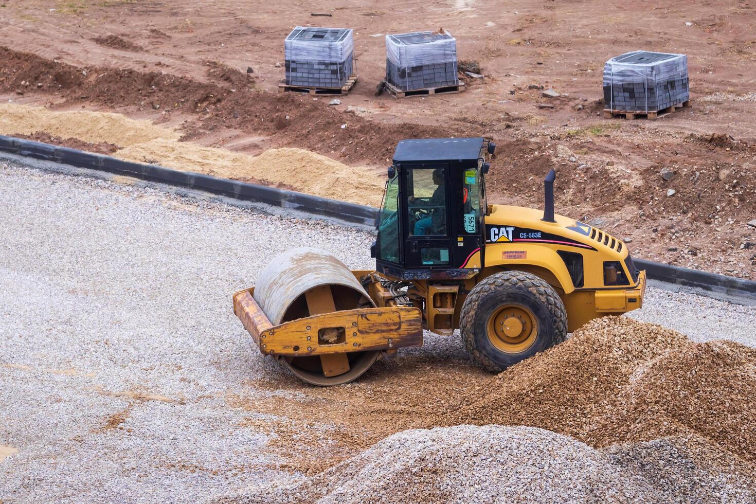 Russia, Kaluga - OCTOBER 27, 2020 An asphalt roller that levels the road surface before placing asphalt. photo