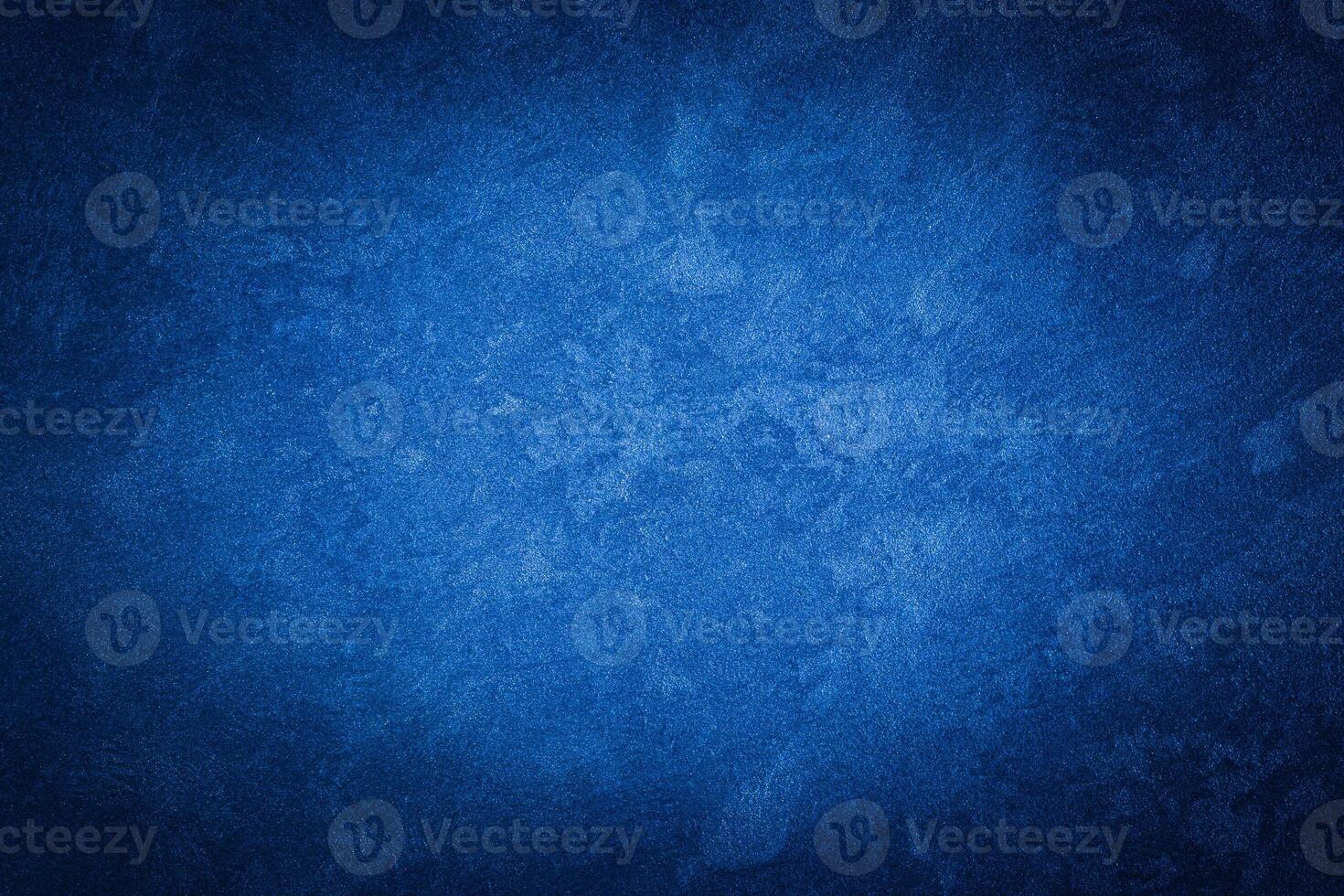 Blue decorative plaster texture with vignette. Abstract grunge background with copy space. photo