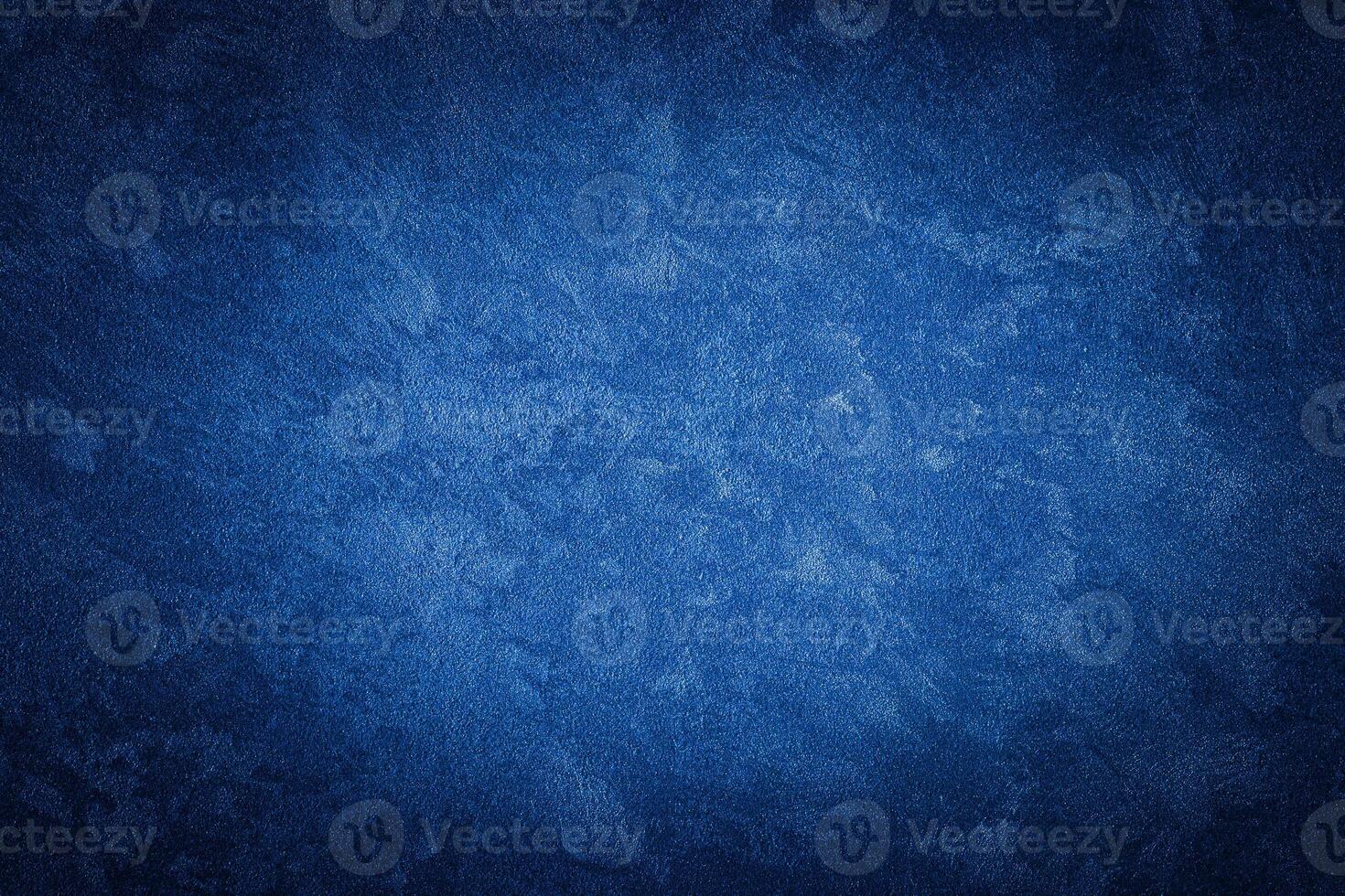 Blue decorative plaster texture with vignette. Abstract grunge background with copy space. photo