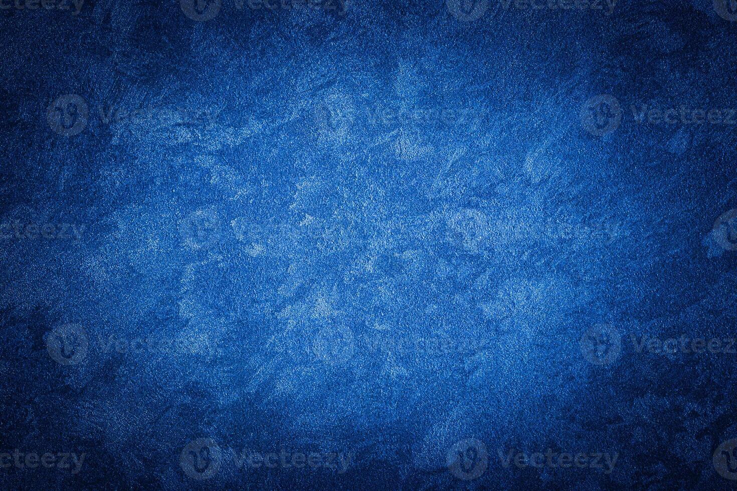 Blue decorative plaster texture with vignette. Abstract grunge background with copy space. photo