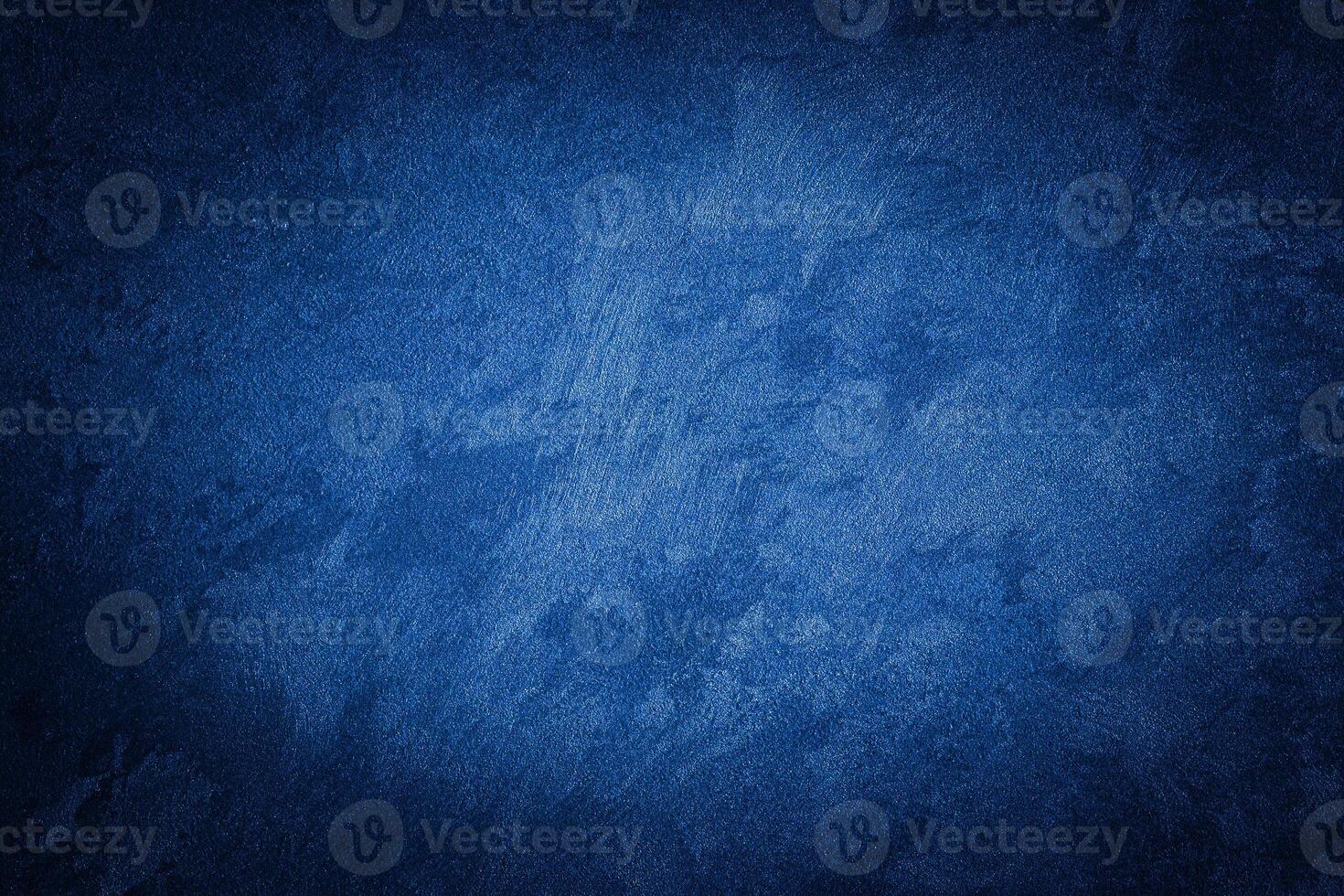 Blue decorative plaster texture with vignette. Abstract grunge background with copy space. photo