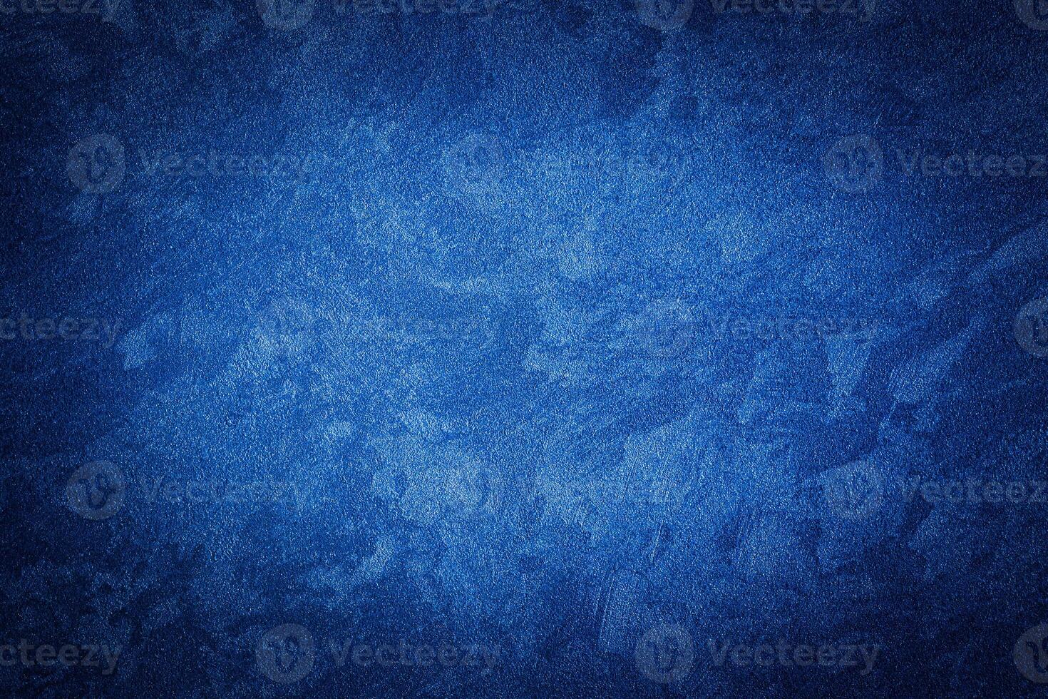 Blue decorative plaster texture with vignette. Abstract grunge background with copy space. photo