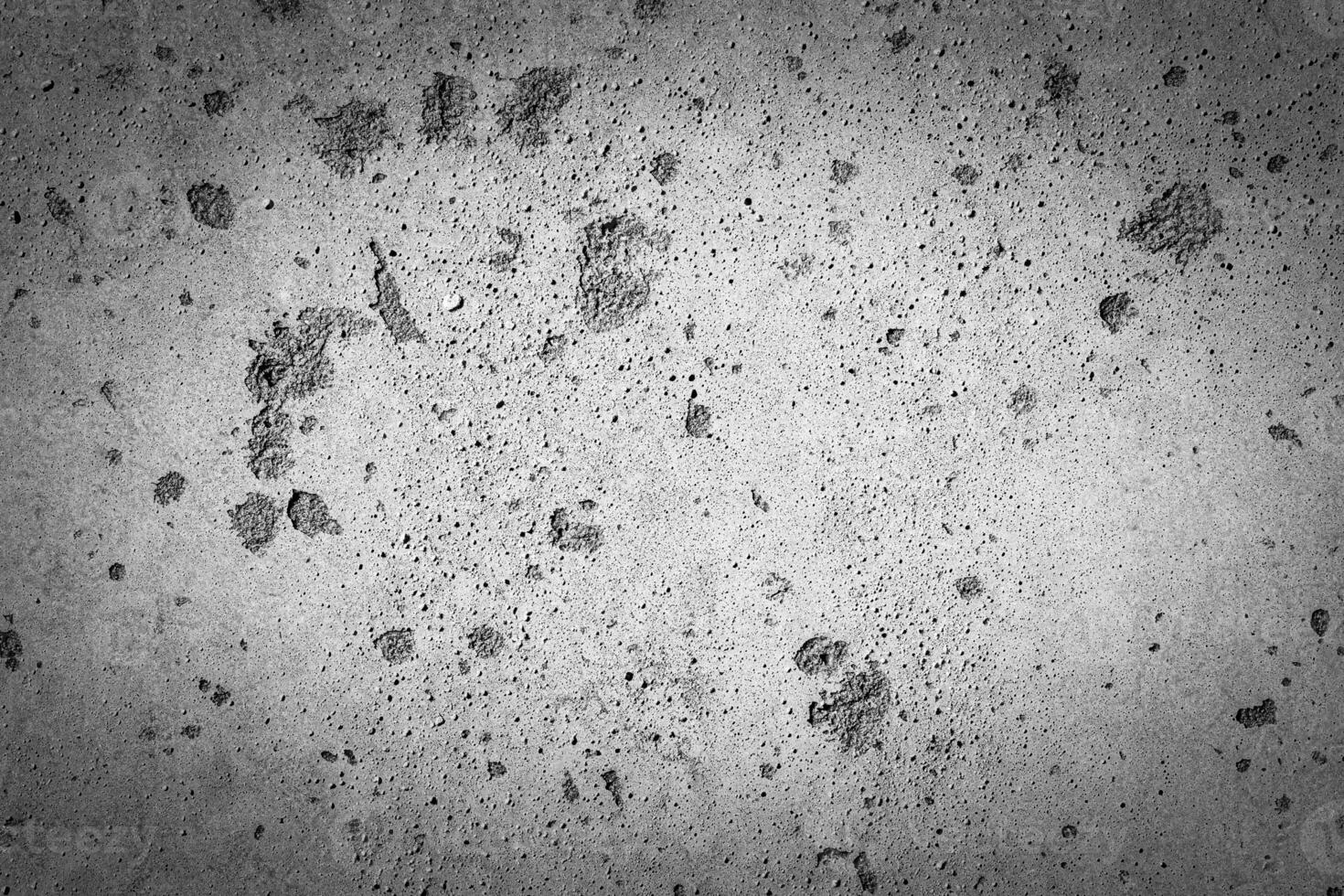Gray concrete texture with vignette. Abstract grunge background with copy space. photo