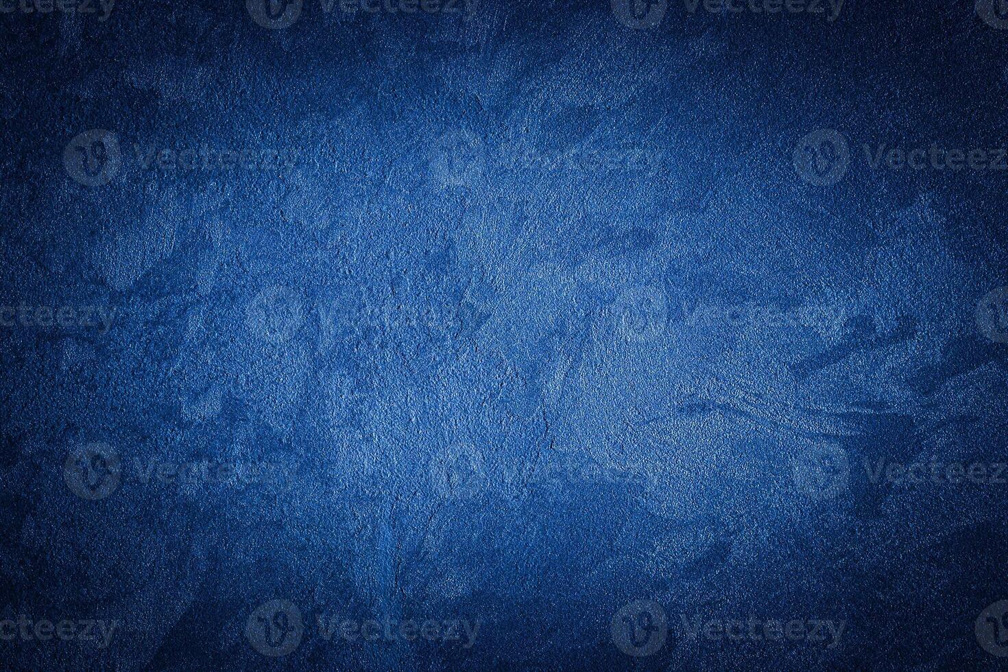 Blue decorative plaster texture with vignette. Abstract grunge background with copy space. photo