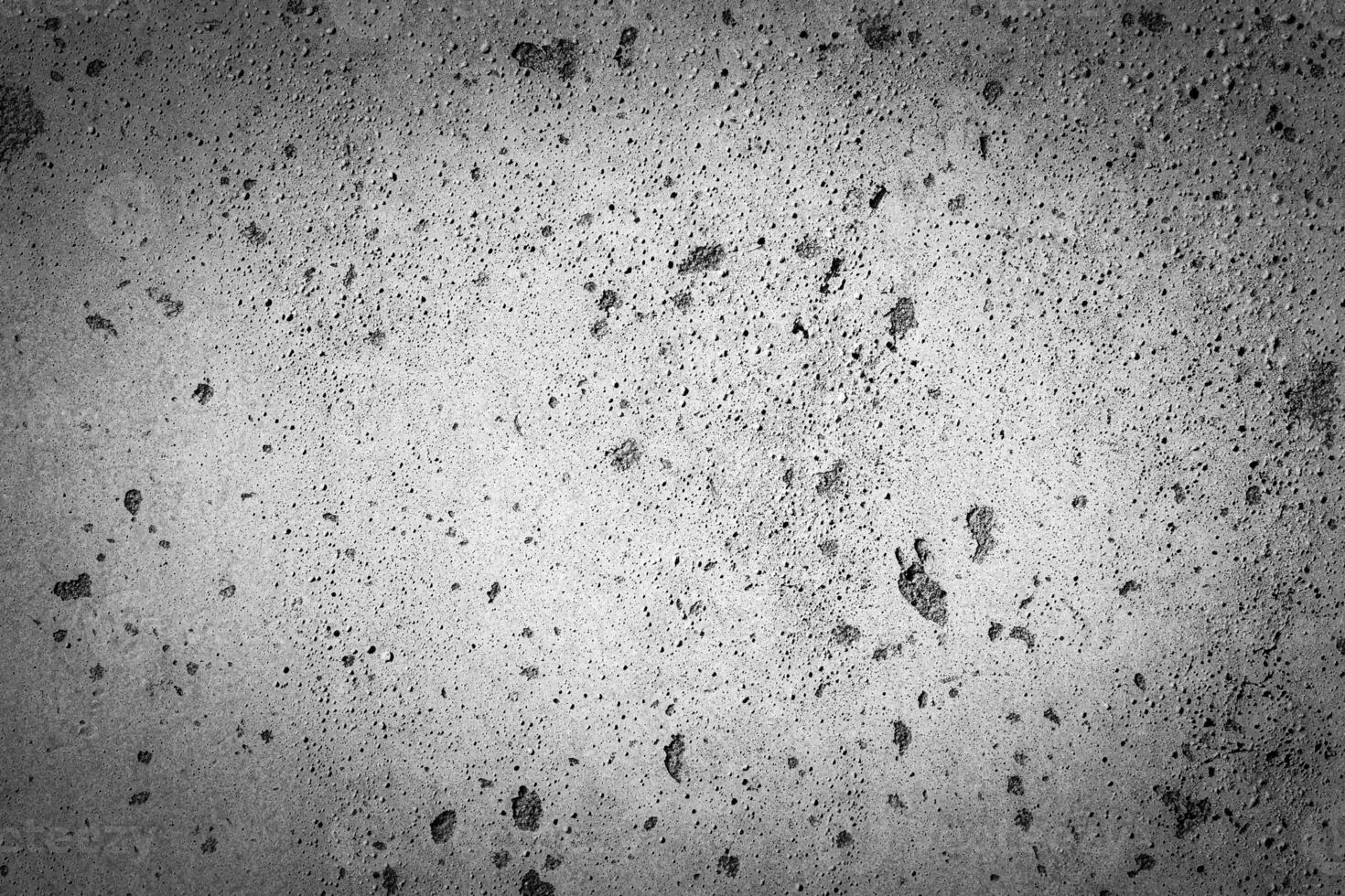 Gray concrete texture with vignette. Abstract grunge background with copy space. photo