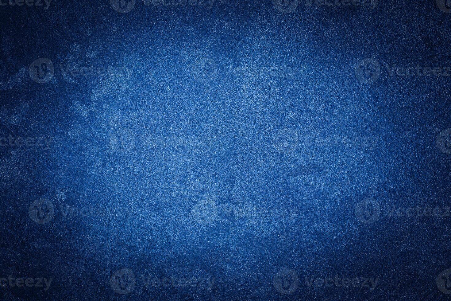 Blue decorative plaster texture with vignette. Abstract grunge background with copy space. photo