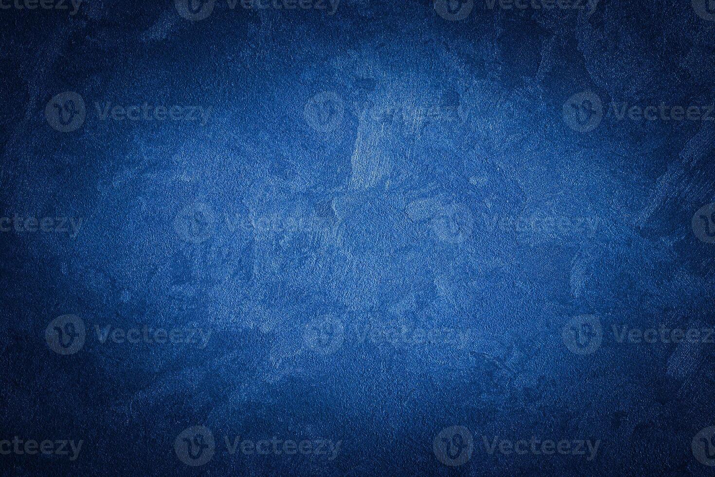 Blue decorative plaster texture with vignette. Abstract grunge background with copy space. photo